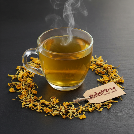Nattrinai Aavarampoo Tea in a clear glass cup with dried yellow cassia flowers and brand tag placed flat on dark slate surface